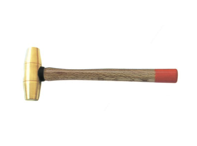 Brass drum with wooden handle hammer