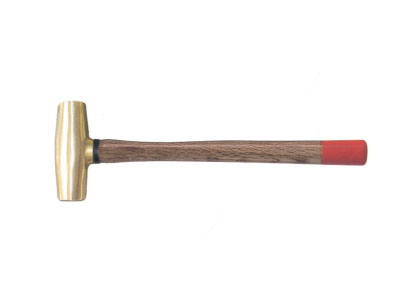 Brass drum with wooden handle hammer